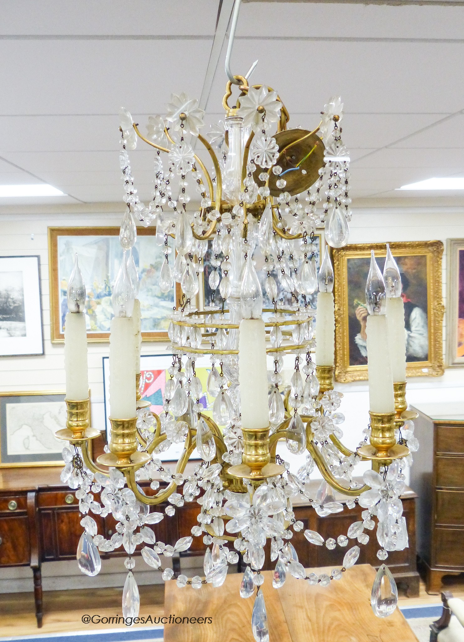 A gilt metal mounted and crystal eight branch chandelier